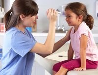 Doctor examining child's eyes