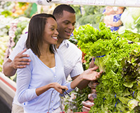 Young couple shopping for produce