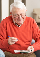 Man doing crossword